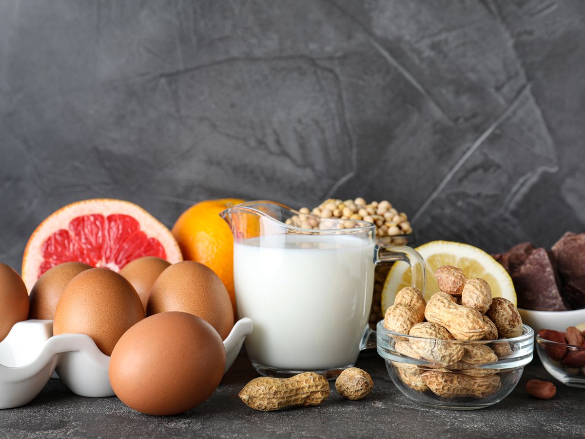 Major food allergens including eggs, milk, peanuts and soybeans arranged on a table