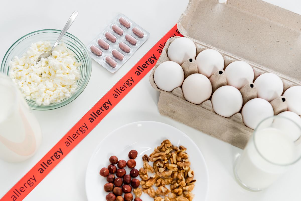 Foods and pills illustrating food allergy and intolerance